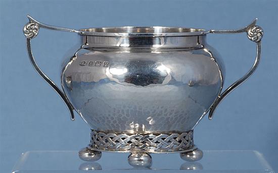 A Georged V silver Arts & Crafts three piece tea set,